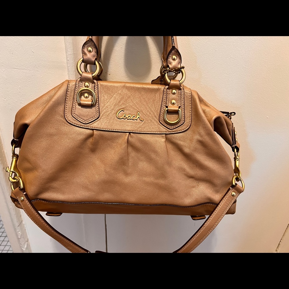 Used Coach bag. From smoke free home. Inside fabric stained.